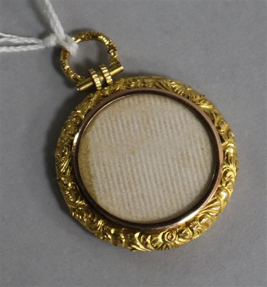 A late 19th/early 20th century yellow metal mounted pendant locket, 30mm.